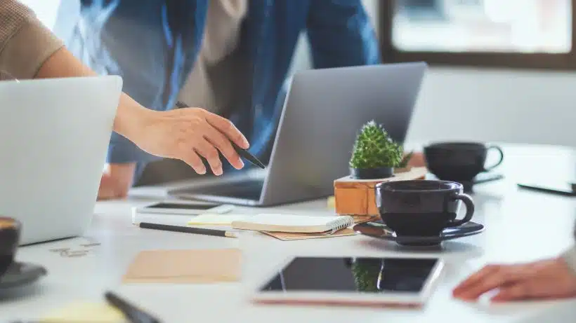 Group of businessman discussing and  working on laptop computer